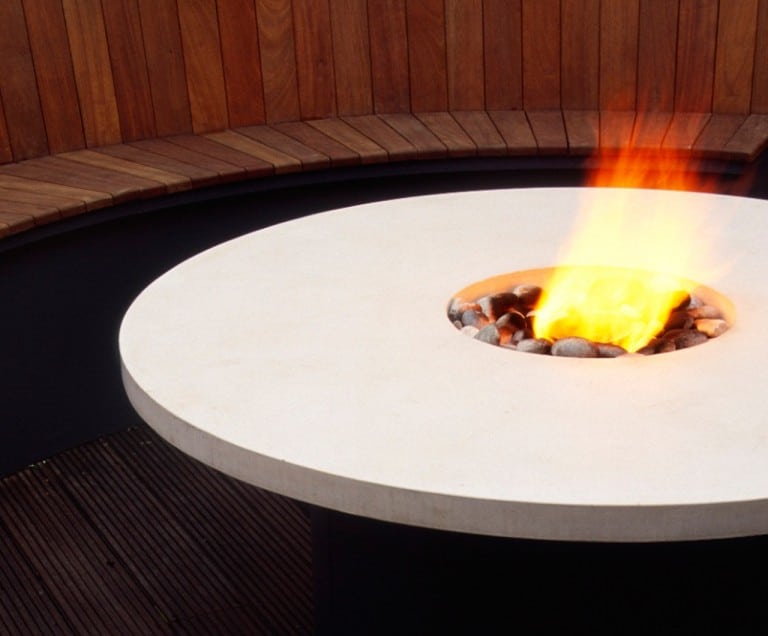 2005 Design and Decoration Award winner - circular seating area around a table with a firepit