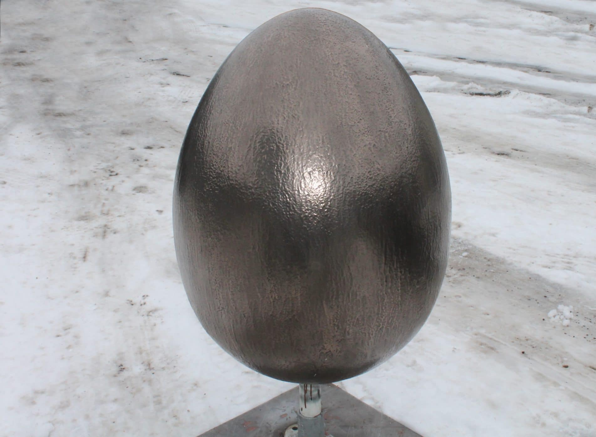Egg sculpture with tactile bronze shell