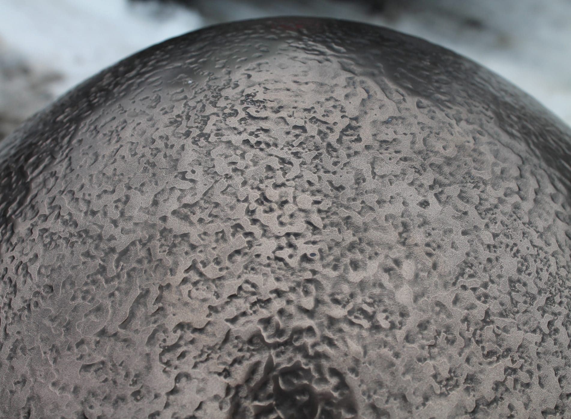 Close up of the patina and patternation of the bronze shell of the 2013 Big Egg Hunt Egg sculpture