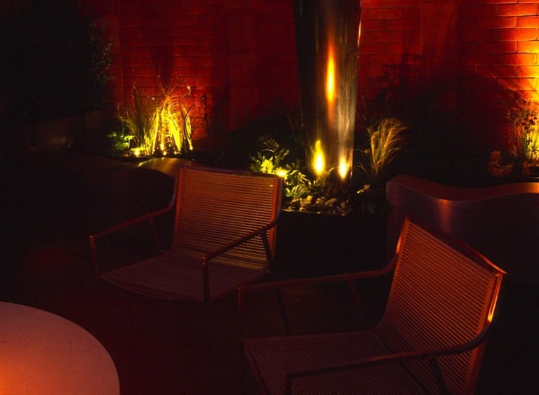 Knightsbridge Roof Terrace at night with lighting highlighting the plants and providing a feeling of warmth