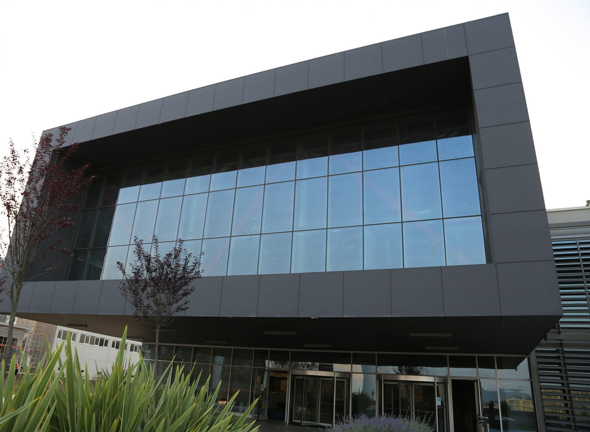 Modern entrance to the University building with large rectangular first floor window