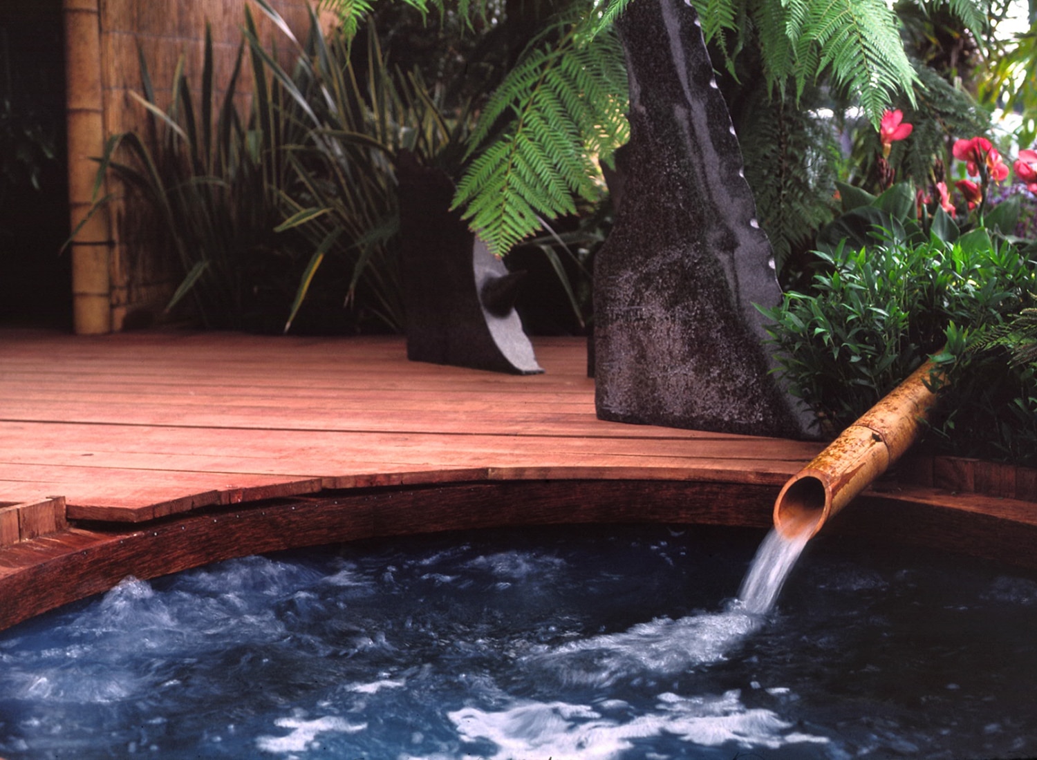 Water feature with bamboo pipe in the garden at RHS Hampton Court Flower Show 1998