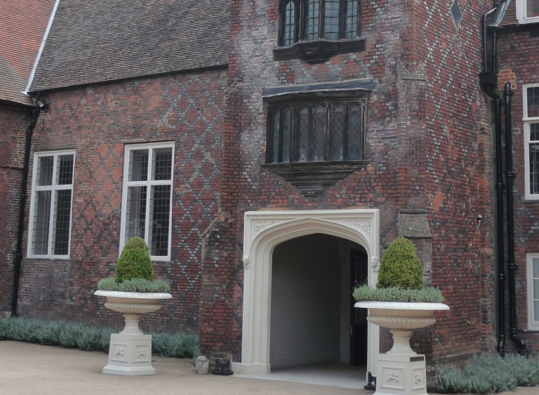 The beautiful entrance to Fulham Palace with planters either side of the grand porch