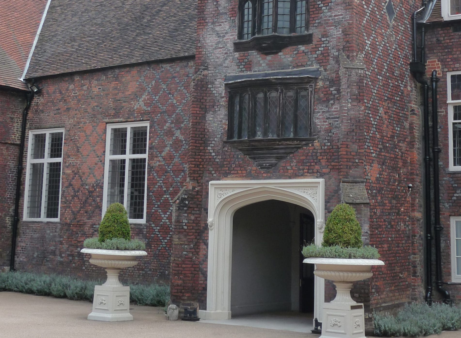 The beautiful entrance to Fulham Palace with planters either side of the grand porch
