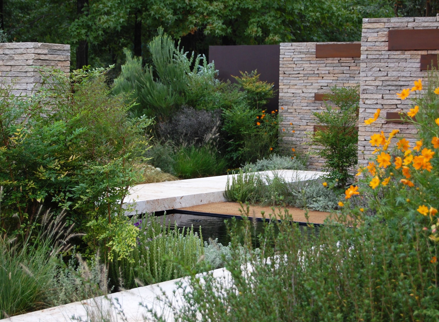 View of the garden for the Gardening World Cup 2010 showing the contrast between the flowers and greenery and the metal and stone