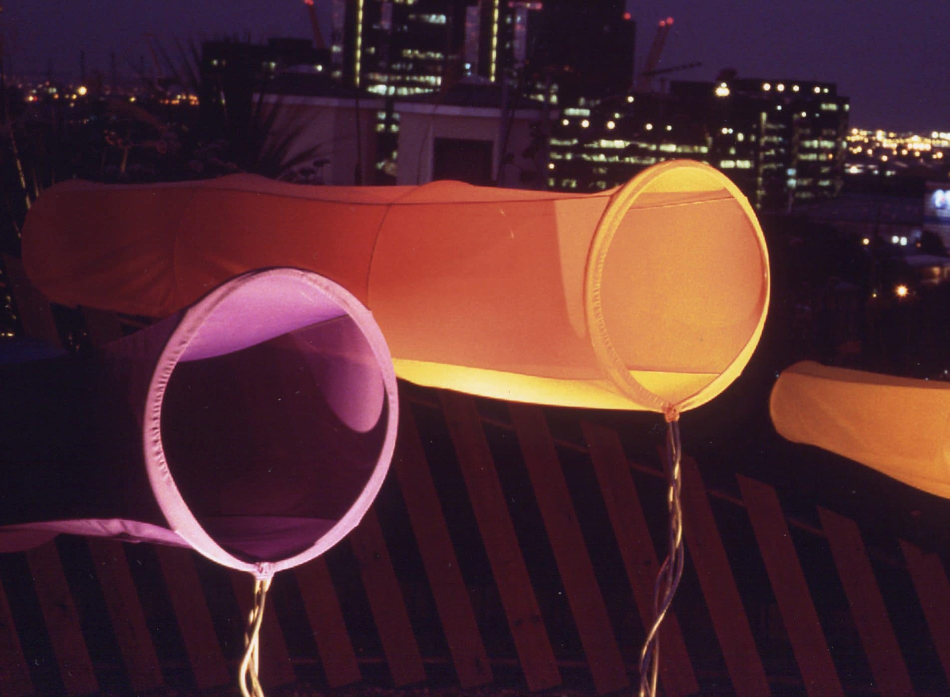 Close up of orange and purple windsock sculptures - roof terrace in Docklands