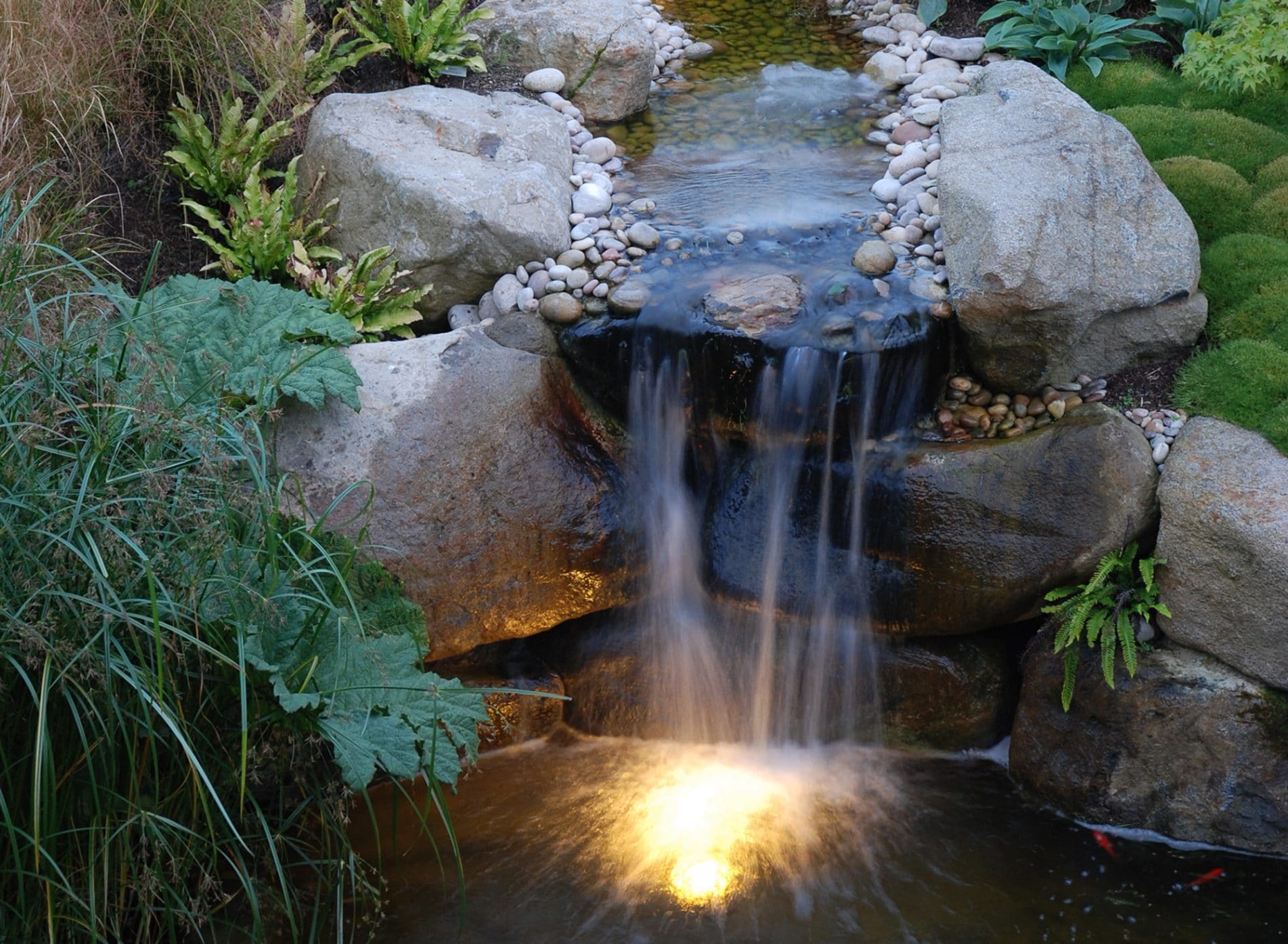 Beautiful traditional style water feature - Modern Japanese Garden