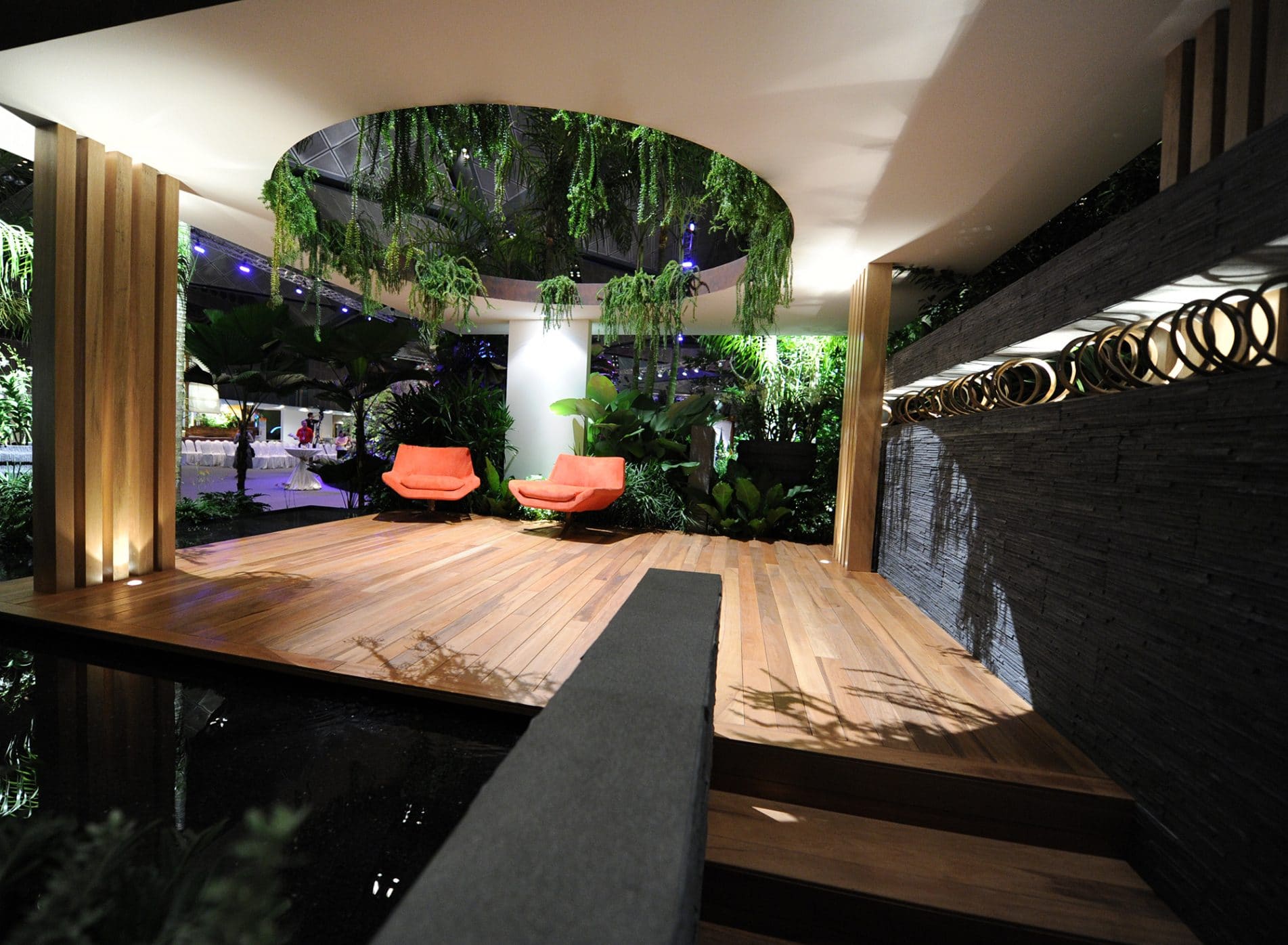 Semi-open shelter with orange seating - Singapore Garden Festival 2012