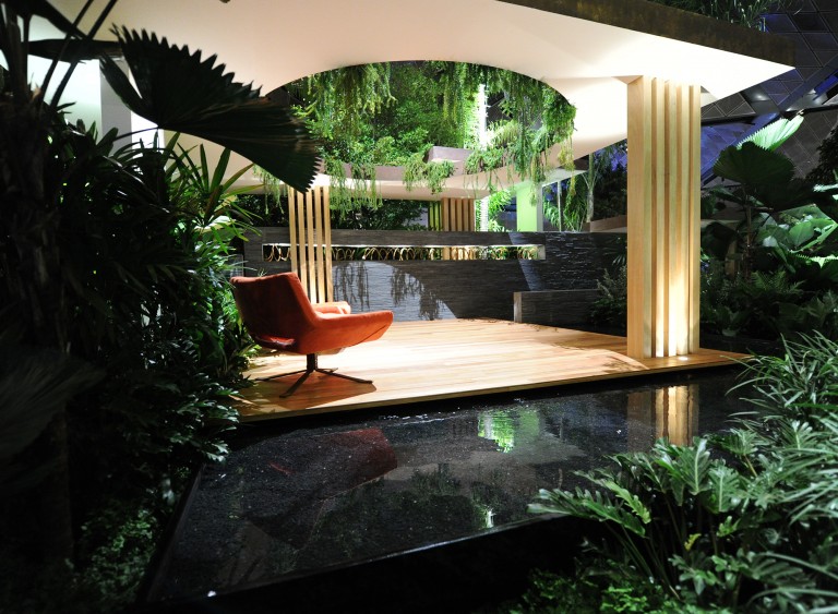 View across the water feature to orange seats