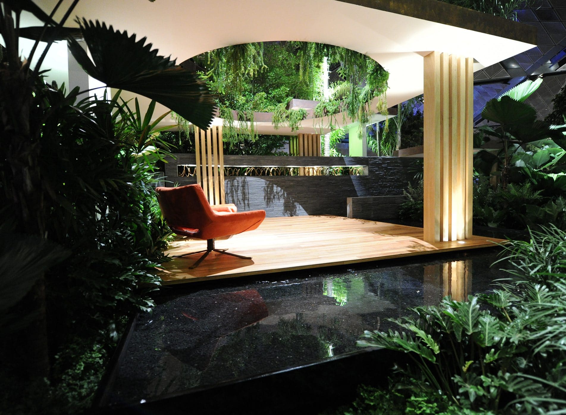 View across the water feature to orange seats