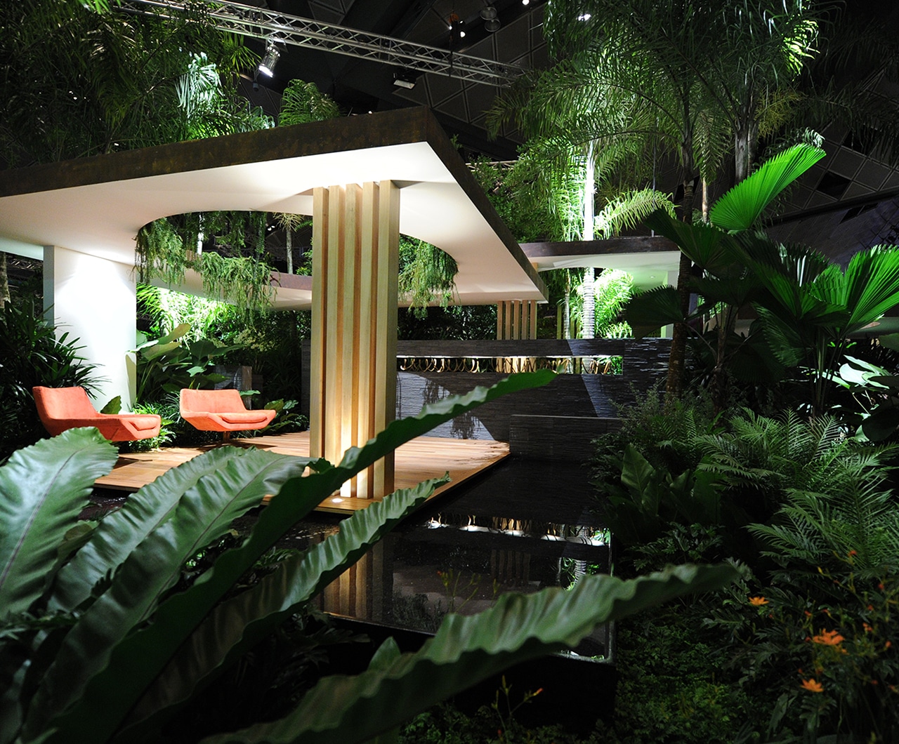 Semi open spaces with orange chairs under a shelter - Singapore Garden Festival 2012