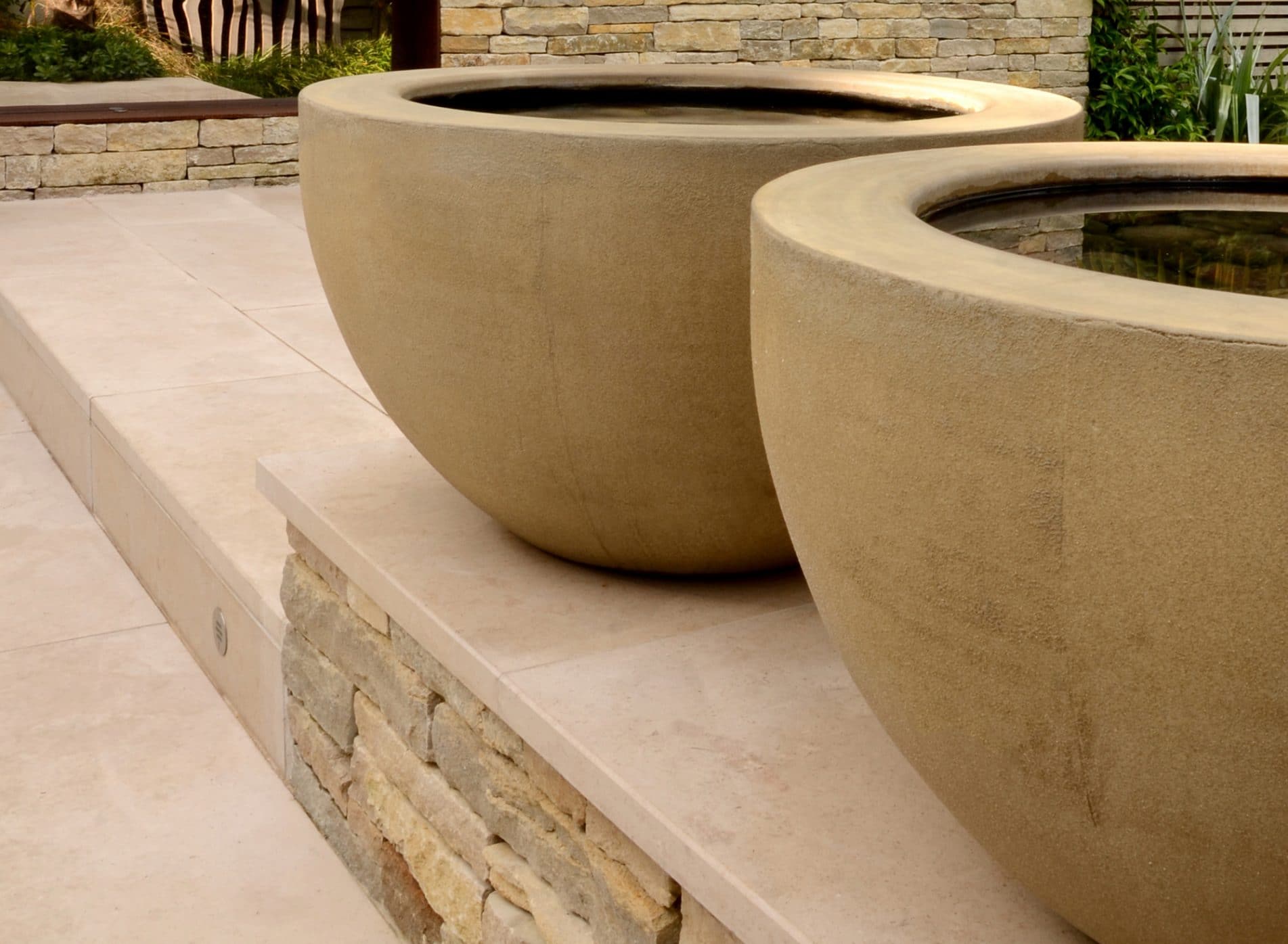 Two large concrete bowl shaped water features