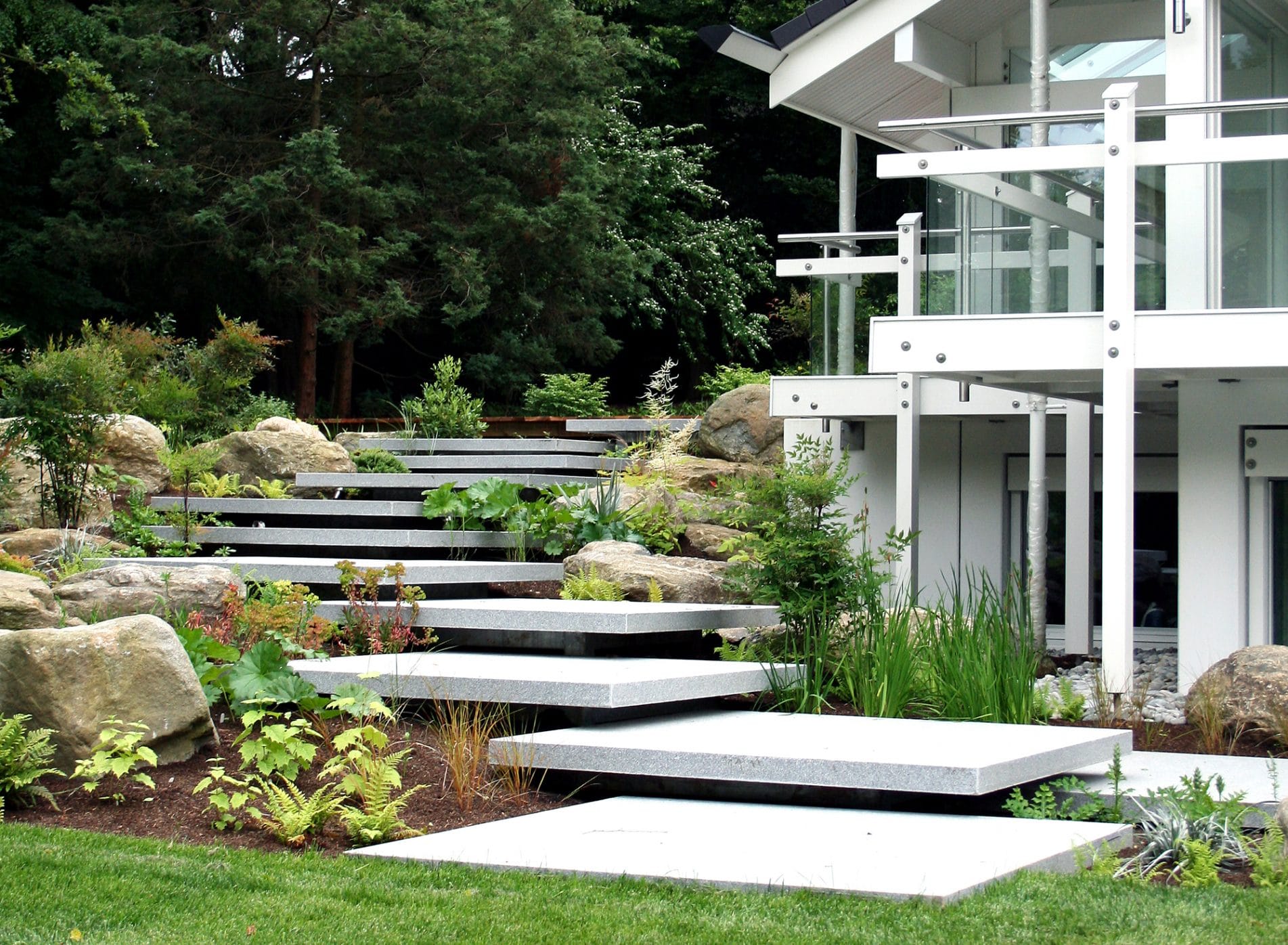 Concrete slab steps up the side of the Huf House