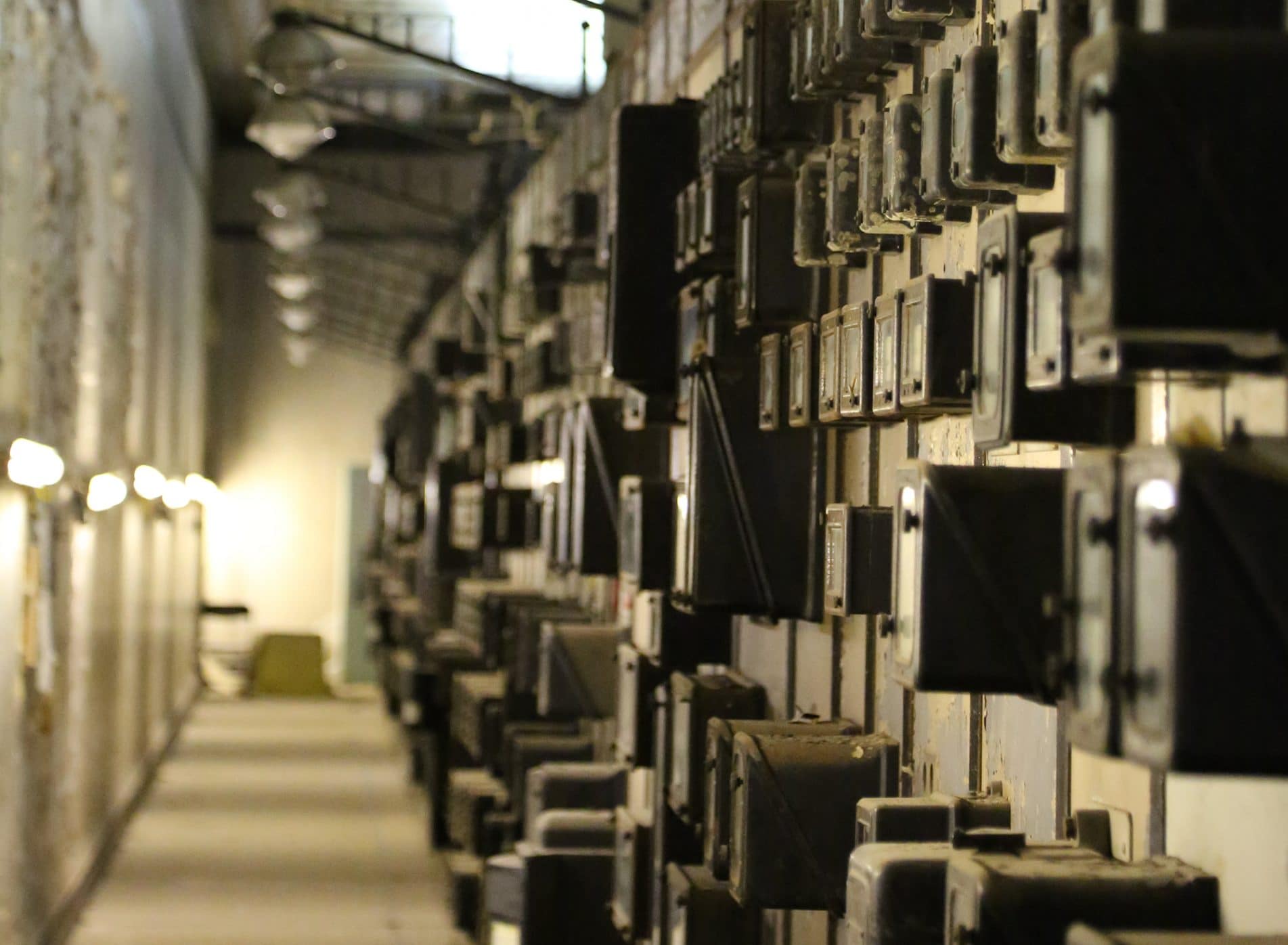 Battersea Power Station interior with a wall of old equipment