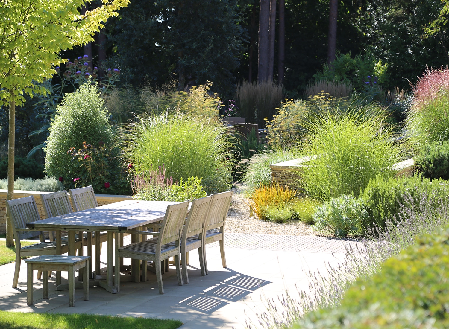 Outdoor Dining Patio Area Surrounded By Greenery