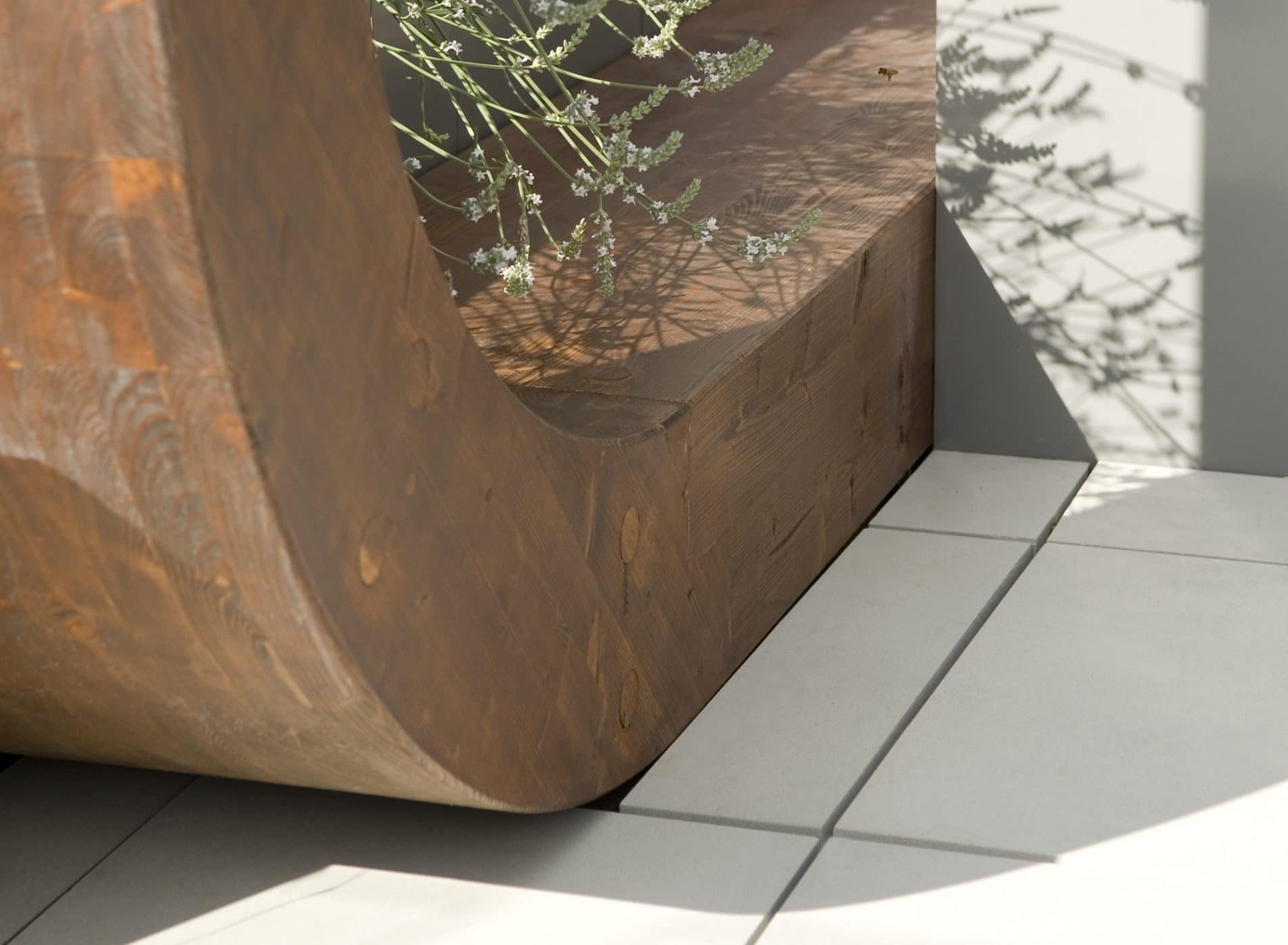 Close up of where a wooden arch meets the floor tiles