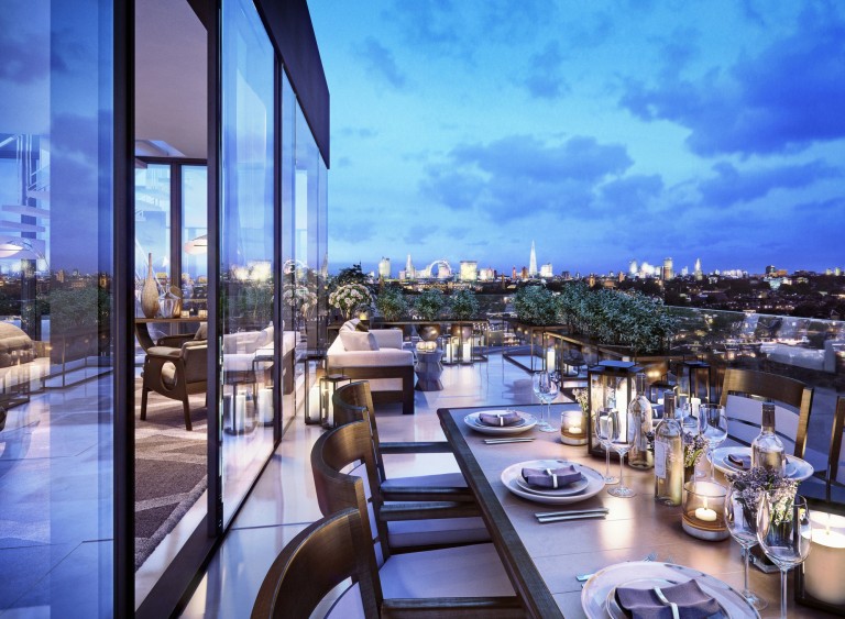 Terrace with dining and seating area at night