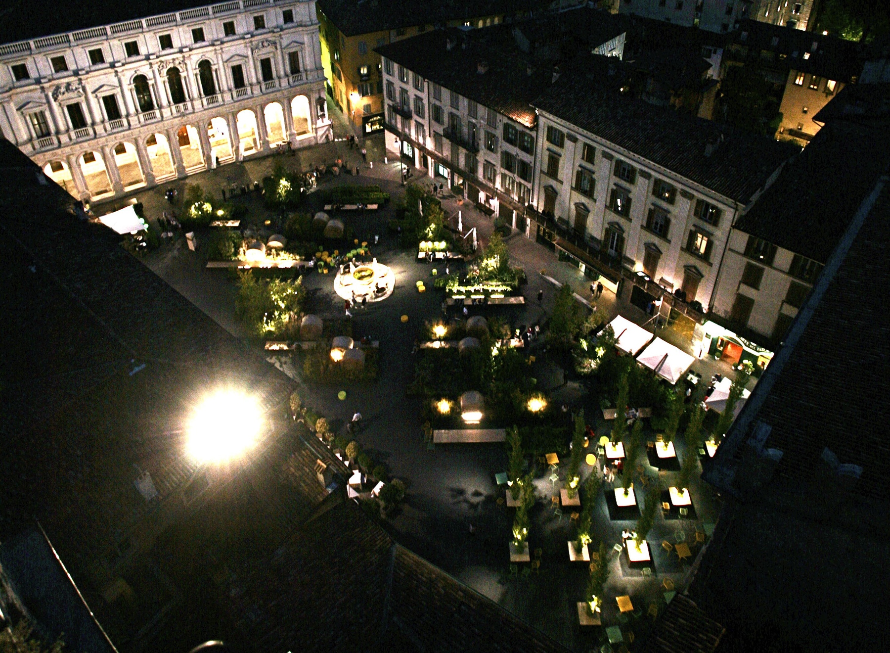 Aerial view of the piazza lit at night