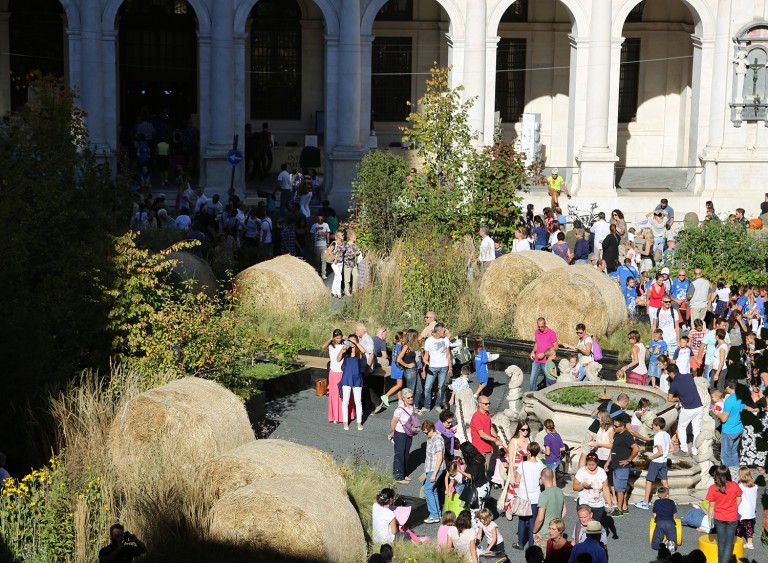 Busy piazza full of people visiting the garden display