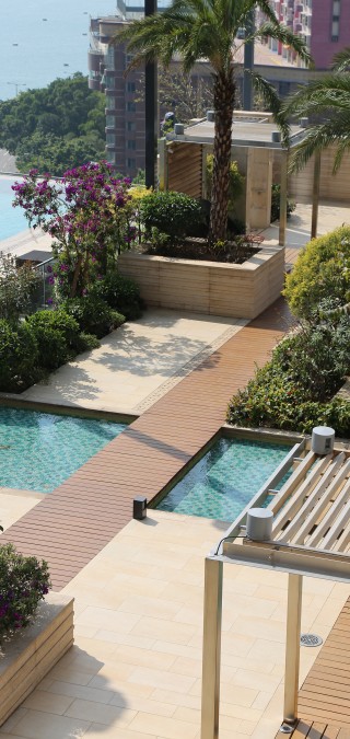 Westminster Terrace Overlooking Hong Kong Harbour Featuring Pathway Surrounded by Greenery And Pools