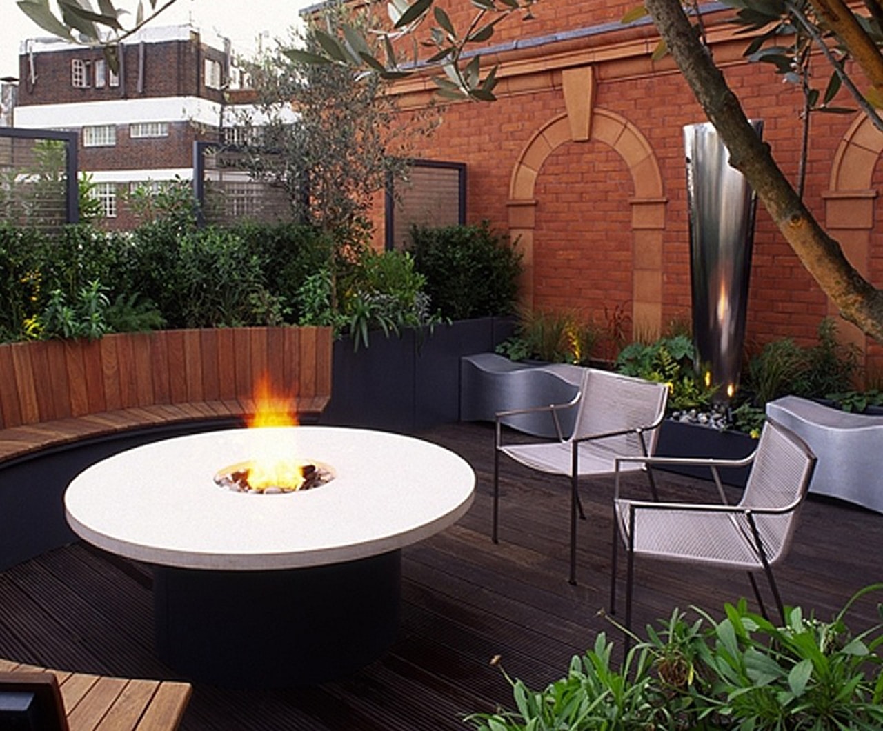 Outdoor Dining Terrace curved seating and round table with firepit in the centre