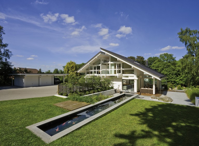 View of the architectural pond with koi carp, looking back towards the White Huf House