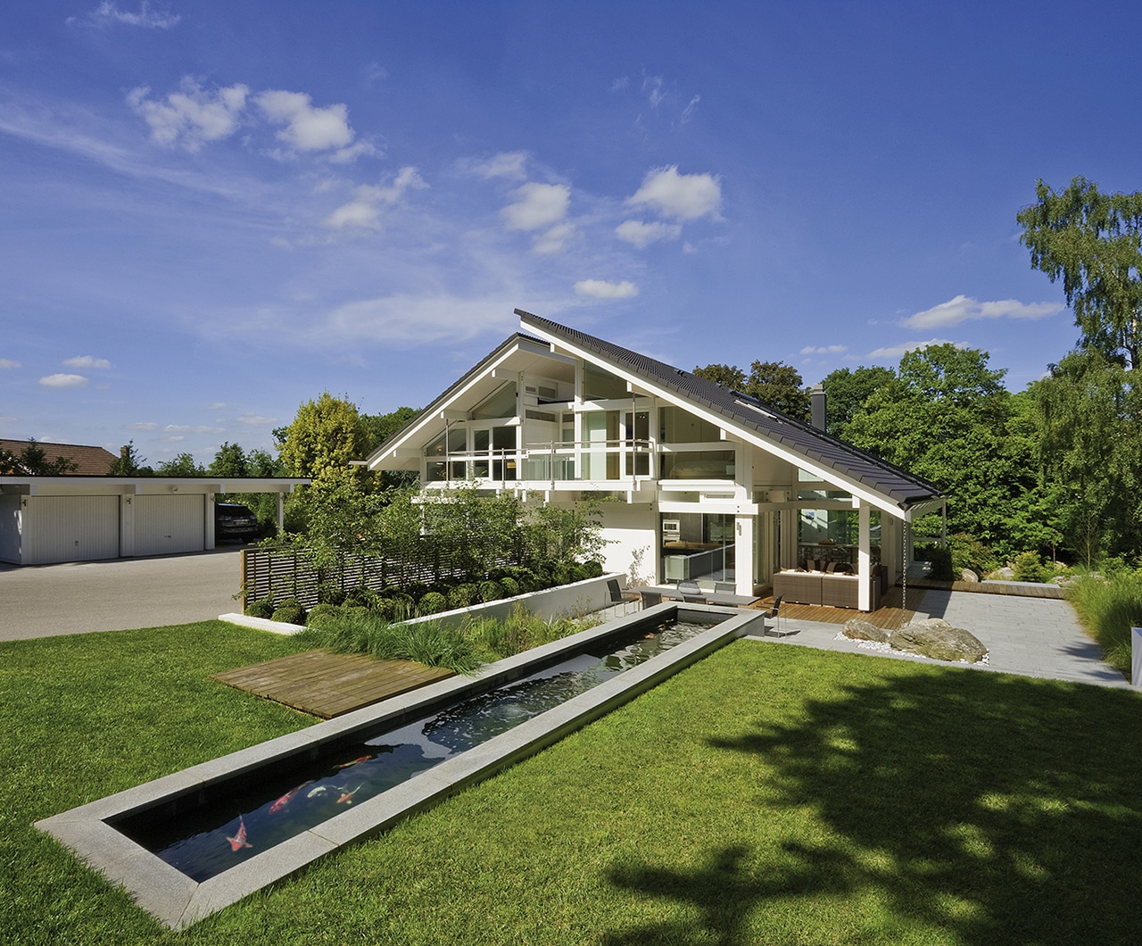 View of the architectural pond with koi carp, looking back towards the White Huf House