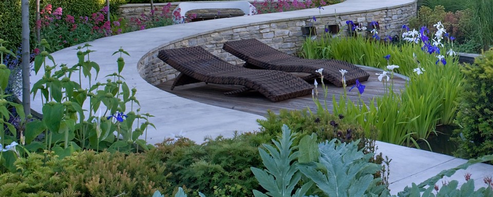 The snaking curved path through the Tributary Garden viewed looking back to the house