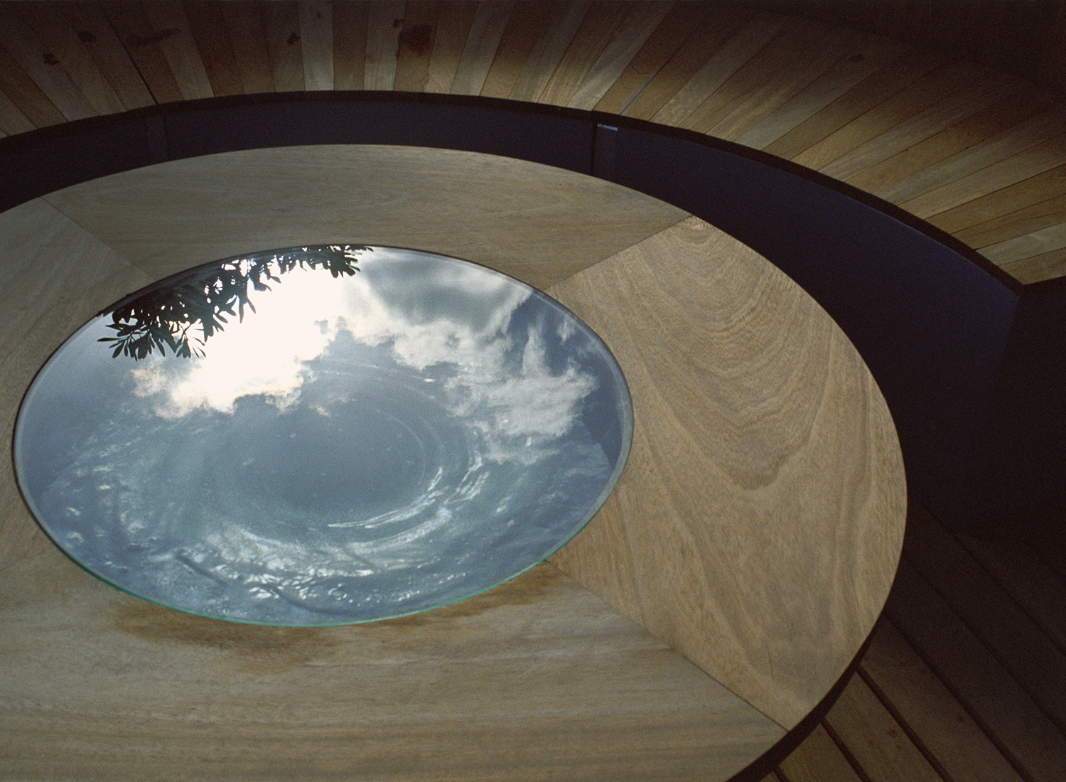 Bespoke table with water swirling inside it to reflect the light