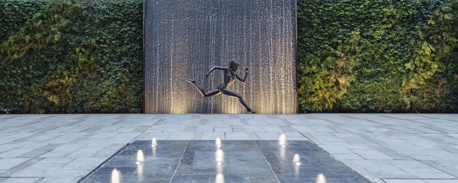 Female Statue Running With Waterfall Backdrop And Fountain Homatin Hillside by Garden Designer Andy Sturgeon