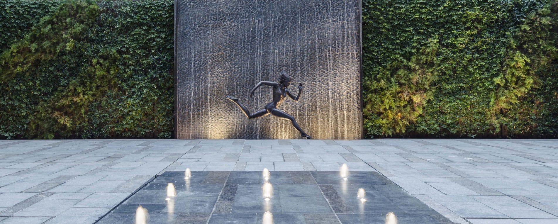 Female Statue Running With Waterfall Backdrop And Fountain Homatin Hillside by Garden Designer Andy Sturgeon