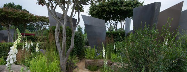 RHS Hampton Court Garden With Stone Sculptures And Foxgloves