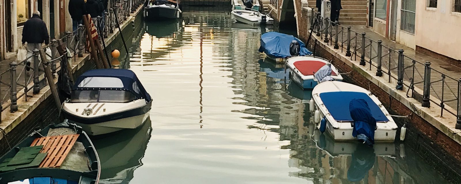 Boats moored on the canals of Venice