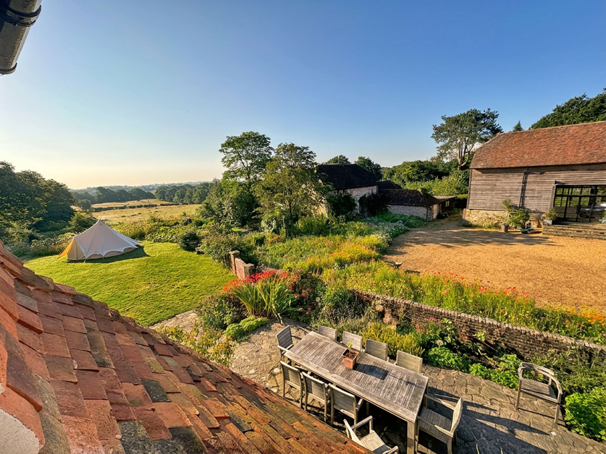 large country estate garden with flower meadow and dining area