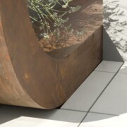 Close up of where a wooden arch meets the floor tiles